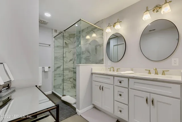 a bathroom with a double vanity sink and a mirror