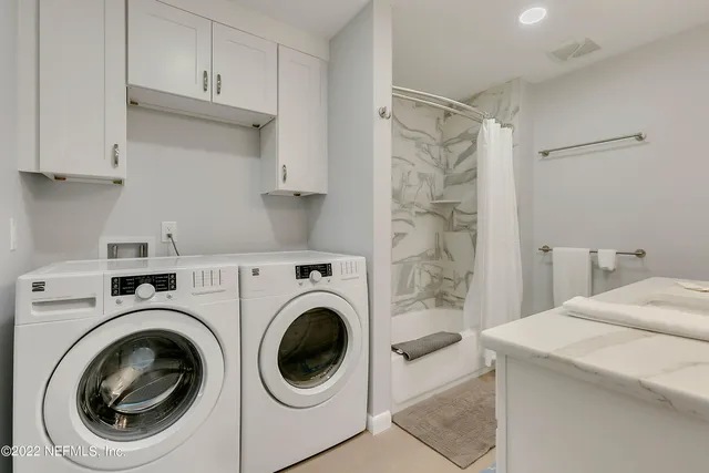 a house view with a seating space and garden