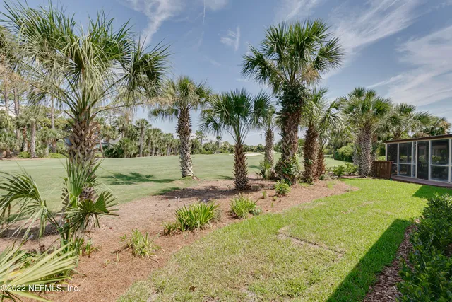 a view of a tree in front of a house