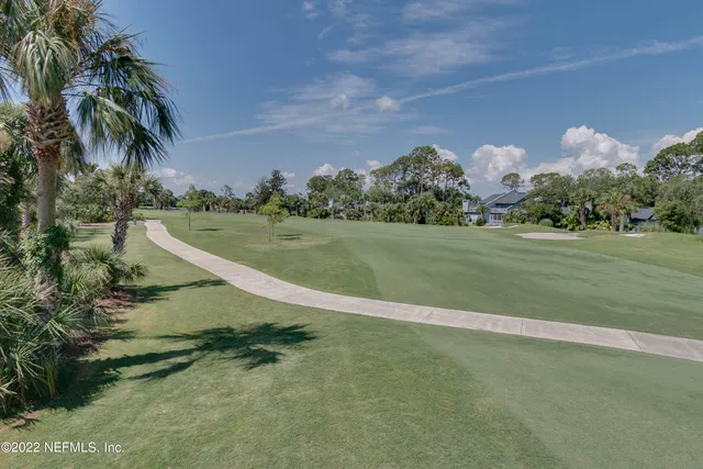 a view of a lake with houses in the back