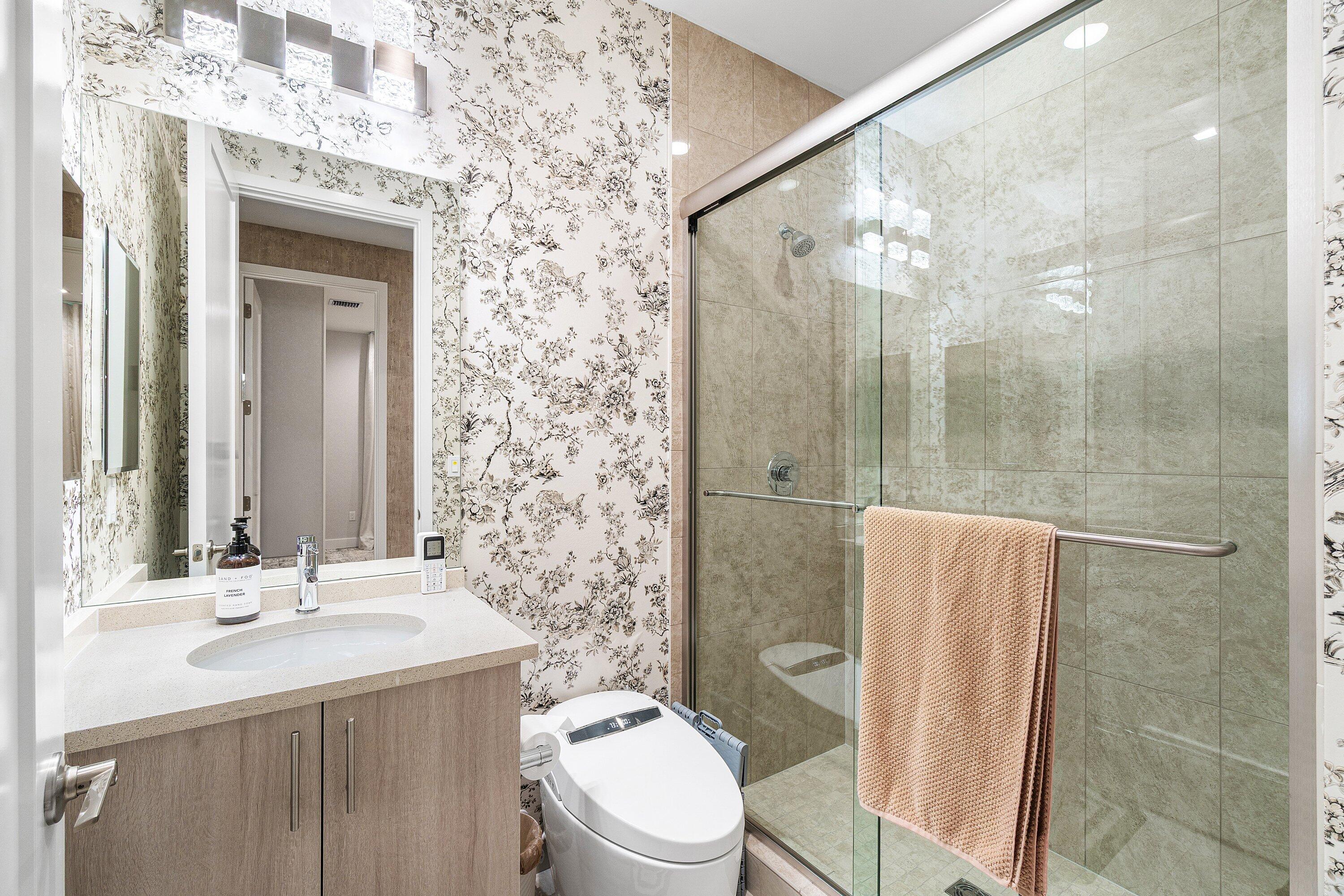 8233 Crystal Downs Avenue Boca Raton, FL 33434 - Photo 40 of 58 a bathroom with a sink toilet and shower