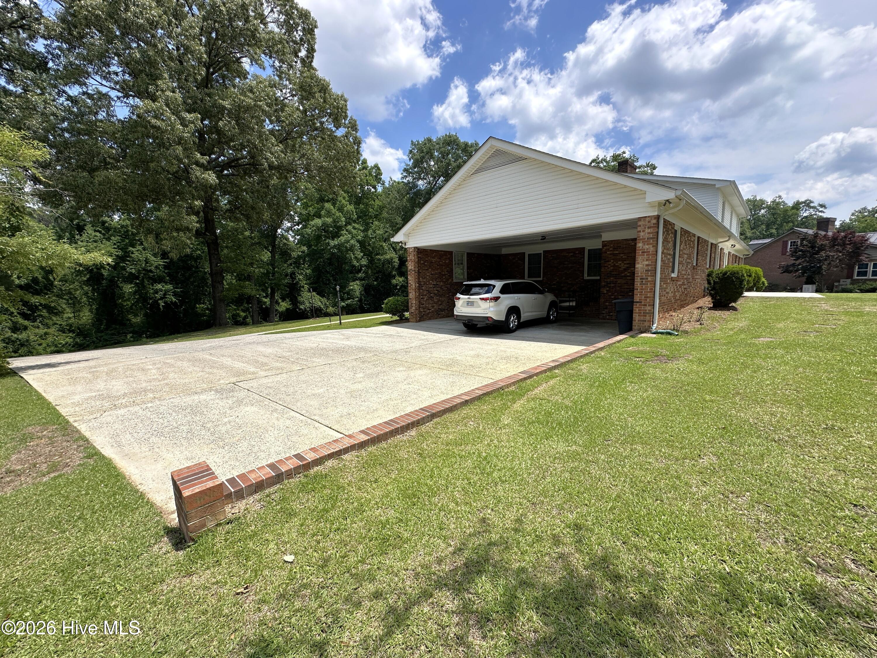 504 Pineview Road Clinton, NC 28328 - Photo 5 of 30 Carport and parking view.