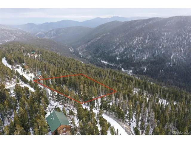 a view of a yard with a mountain