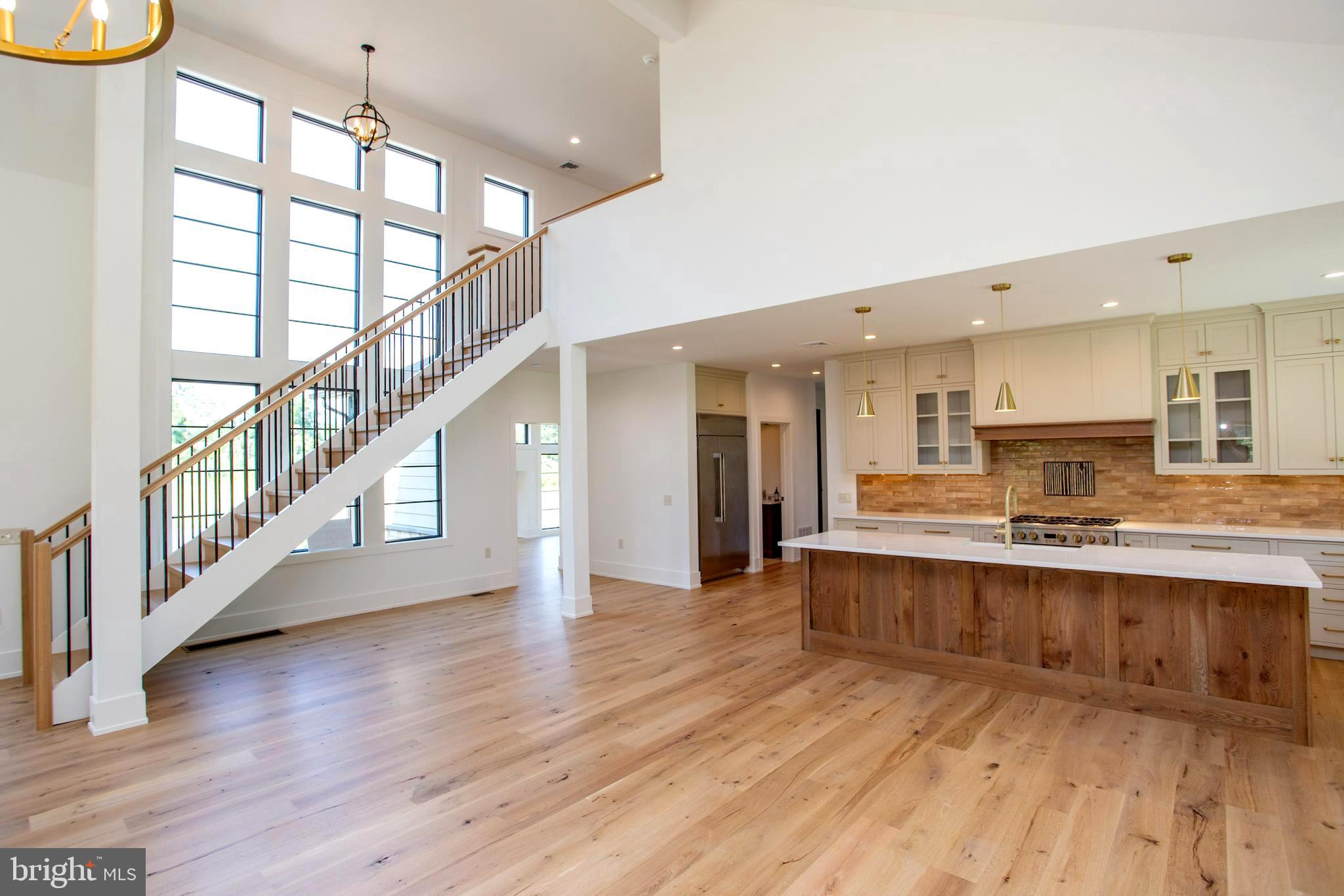 5823 Rodgers Road Pipersville, PA 18947 - Photo 10 of 46 Staircase and Kitchen