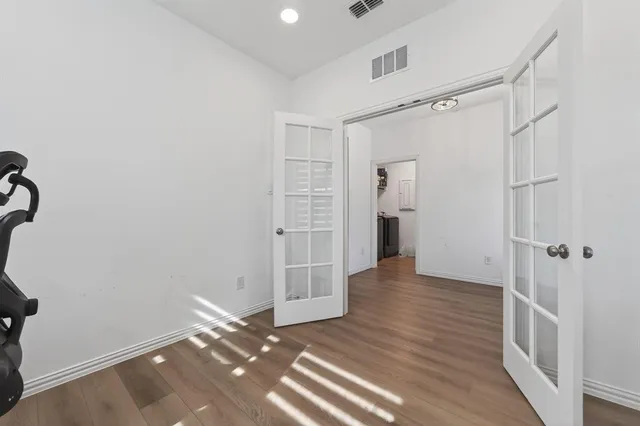 a view of entryway with wooden floor and stairs