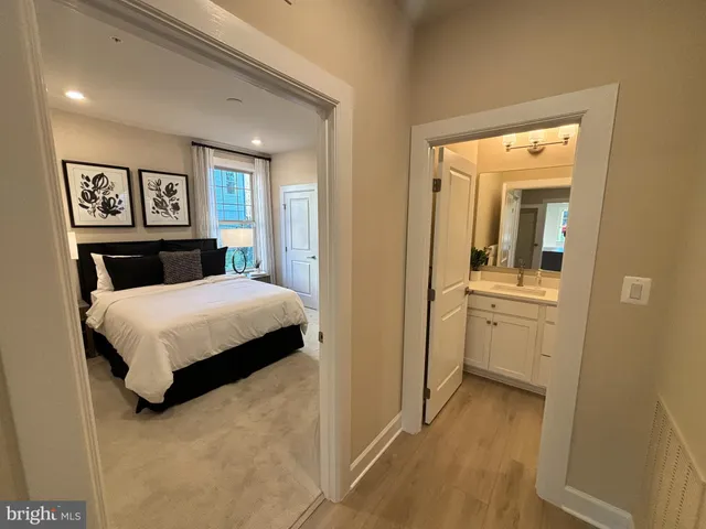 a bedroom with a bed and a view of bathroom