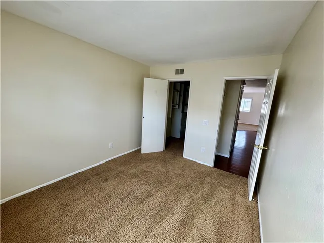 an entryway with wooden floor