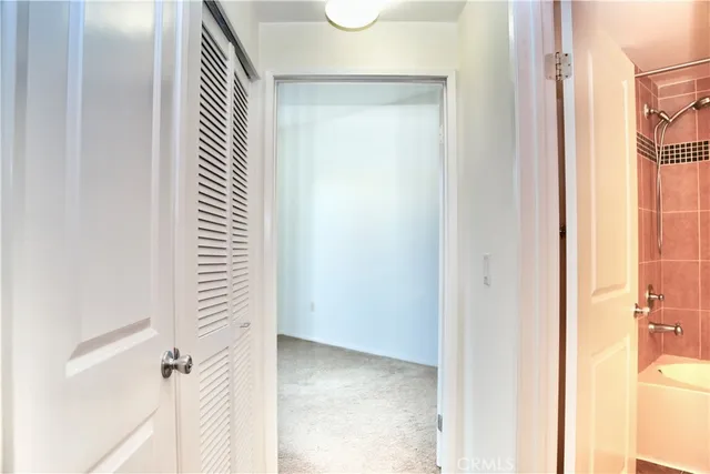 a view of a bedroom with wooden floor