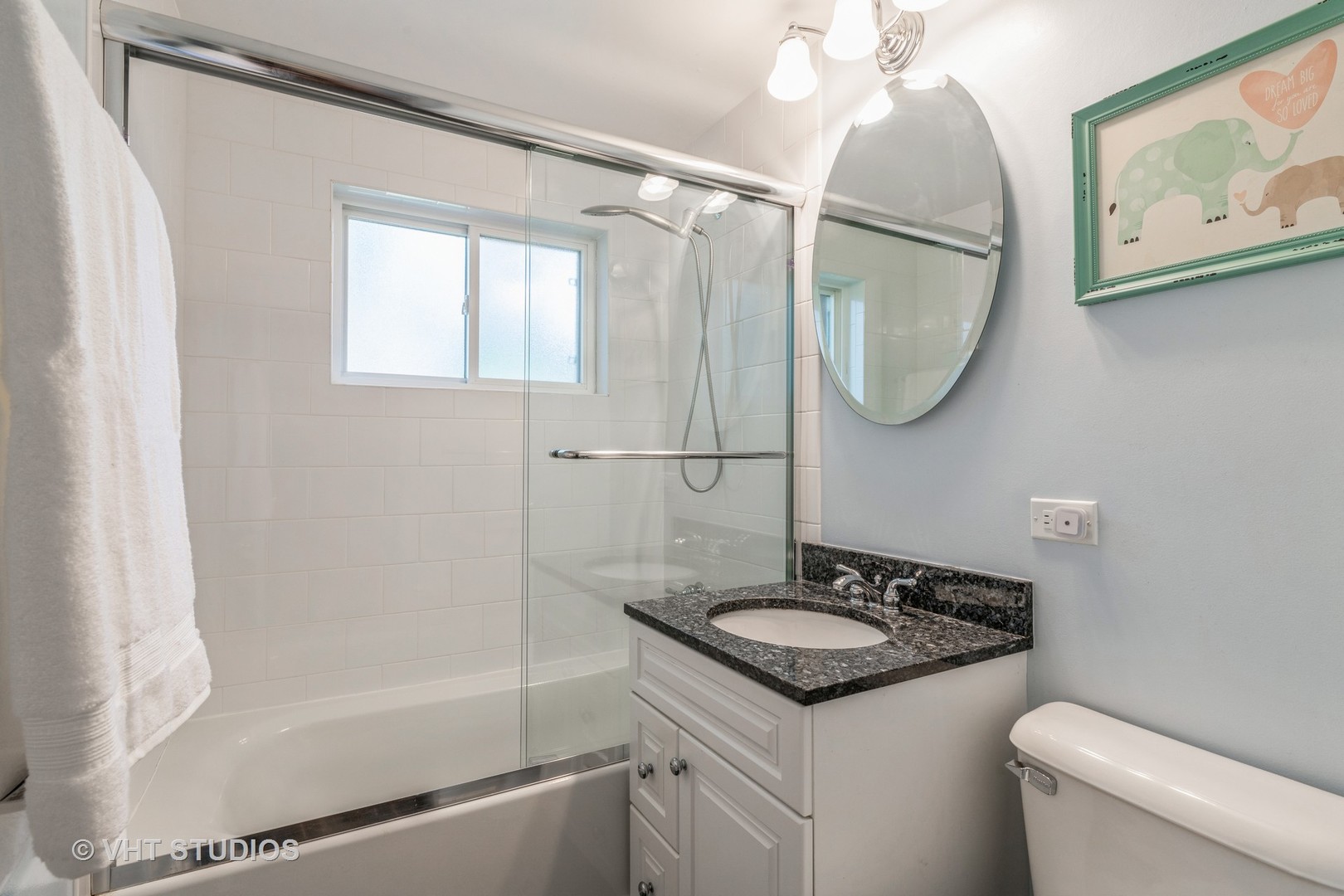 932 Echo Lane Glenview, IL 60025 - Photo 13 of 18 a bathroom with a sink a mirror and a shower