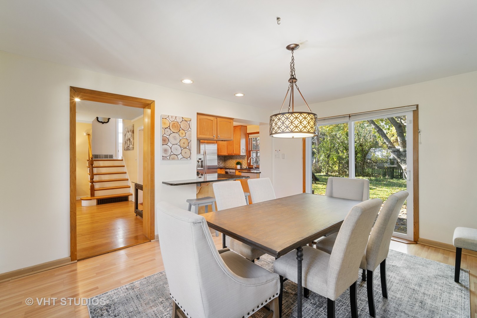 932 Echo Lane Glenview, IL 60025 - Photo 4 of 18 a view of a dining room with furniture window and wooden floor