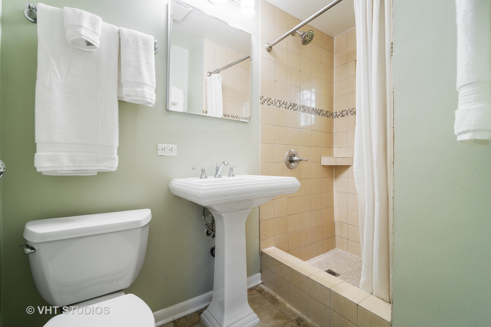 932 Echo Lane Glenview, IL 60025 - Photo 10 of 18 a bathroom with a sink toilet and shower