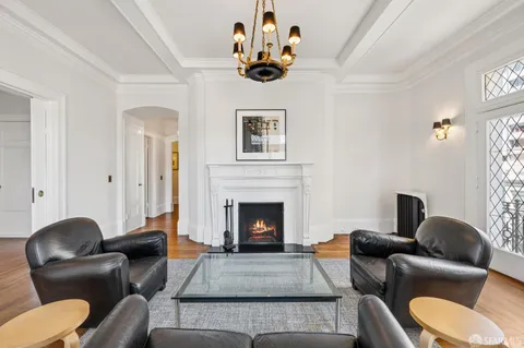 a view of bedroom with wooden floor