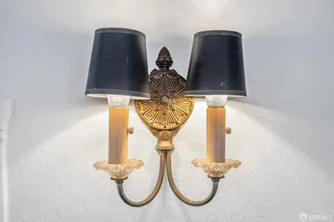 a view of a swimming pool with a dining table and a chandelier