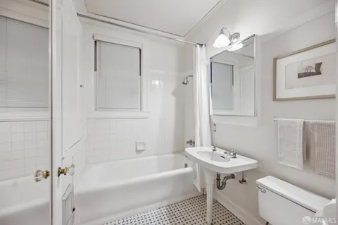 a view of a terrace with a table and chairs