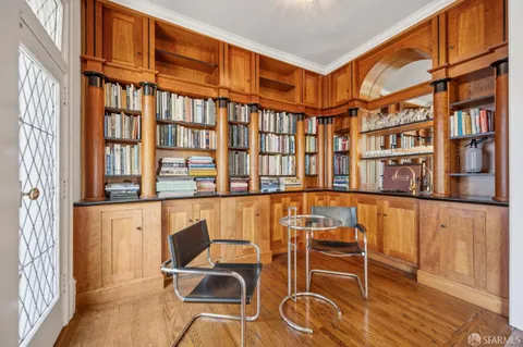 a living room with a fireplace and a fireplace