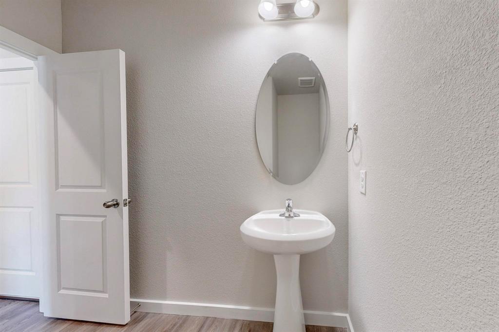 1520 Solterra Boulevard Mesquite, TX 75181 - Photo 10 of 22 a bathroom with a sink and a mirror