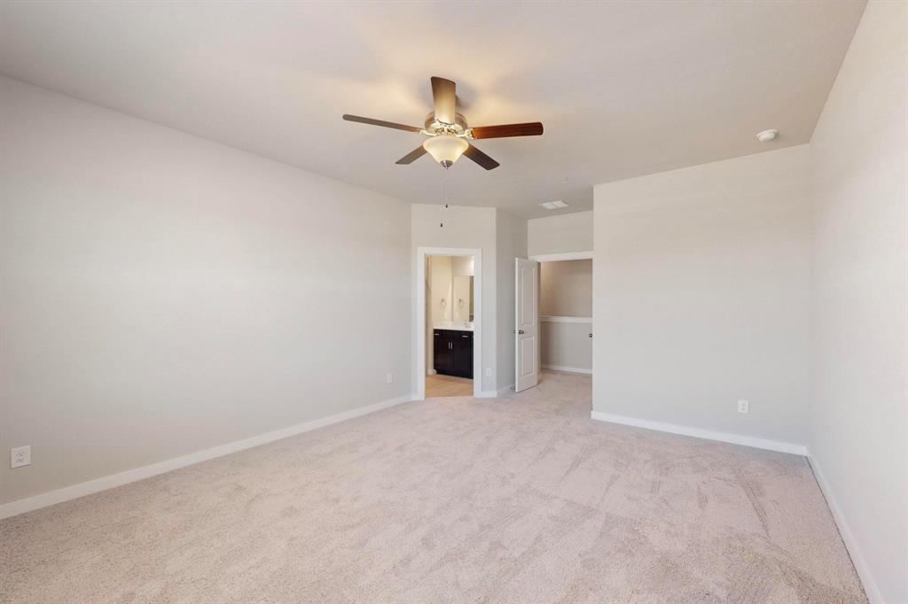 1520 Solterra Boulevard Mesquite, TX 75181 - Photo 12 of 22 an empty room with a ceiling fan and a window
