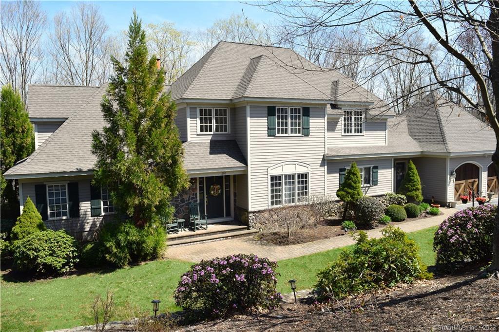 a front view of a house with garden