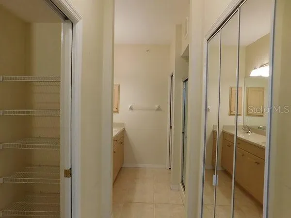 a bathroom with a shower and a glass door