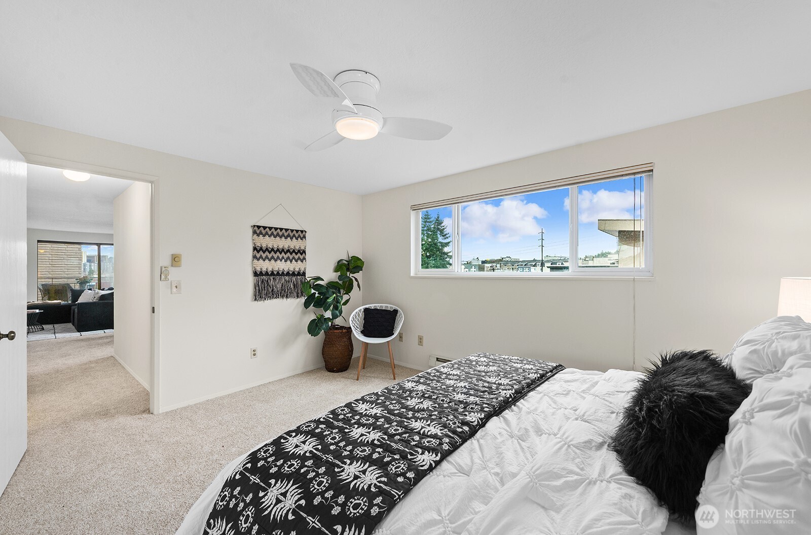 610 Aloha Street, Unit 404 Seattle, WA 98109 - Photo 18 of 23 a bedroom with a large bed and a window