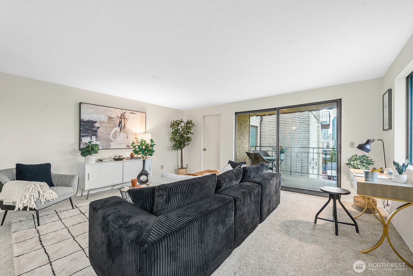 610 Aloha Street, Unit 404 Seattle, WA 98109 - Photo 5 of 23 a living room with furniture and a large window