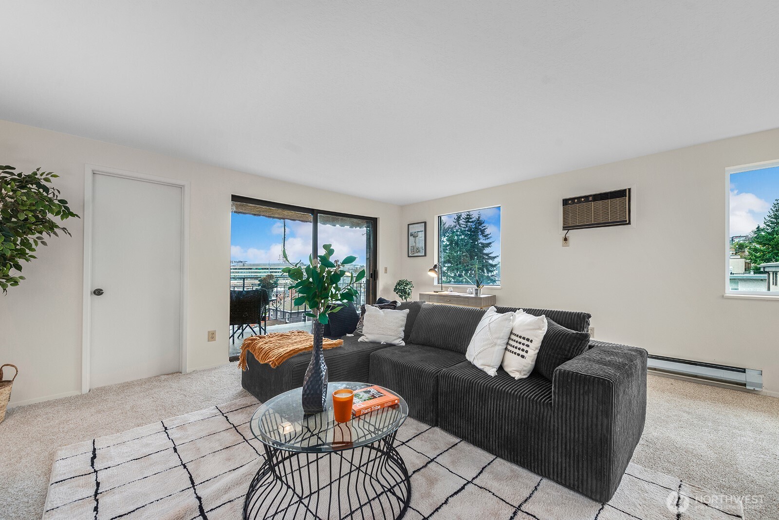 610 Aloha Street, Unit 404 Seattle, WA 98109 - Photo 7 of 23 a living room with furniture and a potted plant