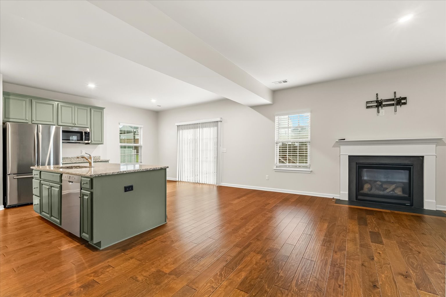 3204 Garrett Lane Columbia, TN 38401 - Photo 14 of 33 a kitchen with stainless steel appliances a stove top oven a refrigerator a sink and a fireplace