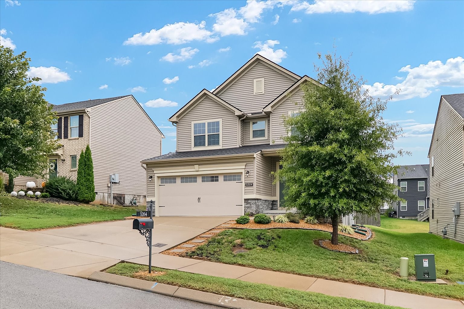 3204 Garrett Lane Columbia, TN 38401 - Photo 2 of 33 a front view of a house with a yard and potted plants