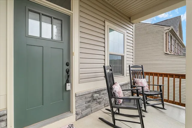 a view of backyard with a deck and furniture