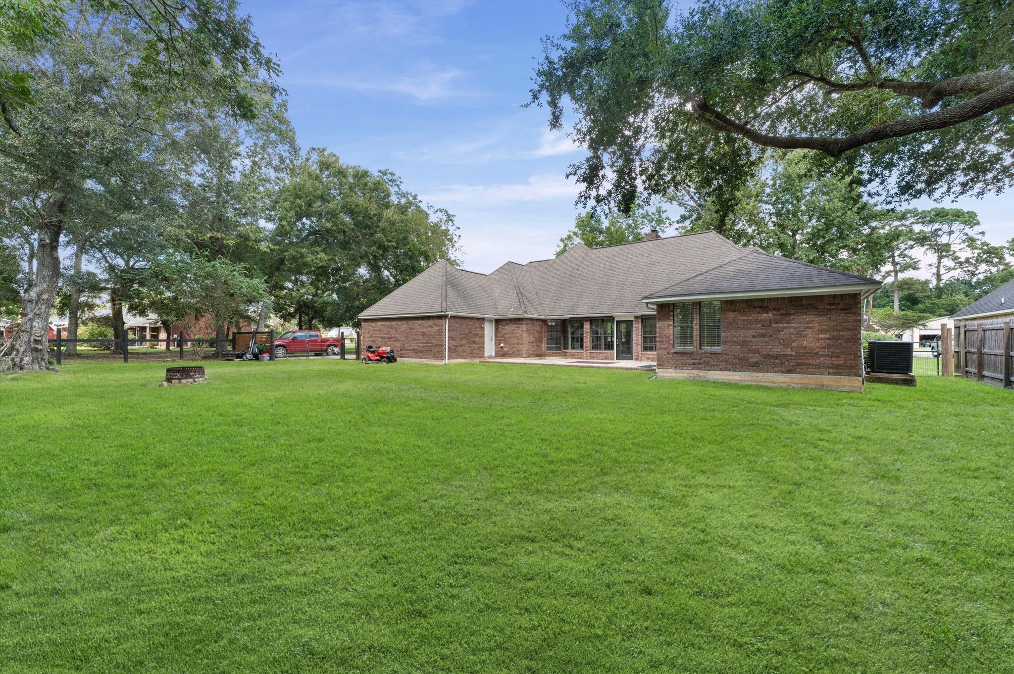 205 Oetken West Road Anahuac, TX 77514 - Photo 26 of 33 A huge backyard with room to roam, relax, garden, entertain-and even keep a few feathered friends! The chicken coop is already here, so your backyard crew can move right in.