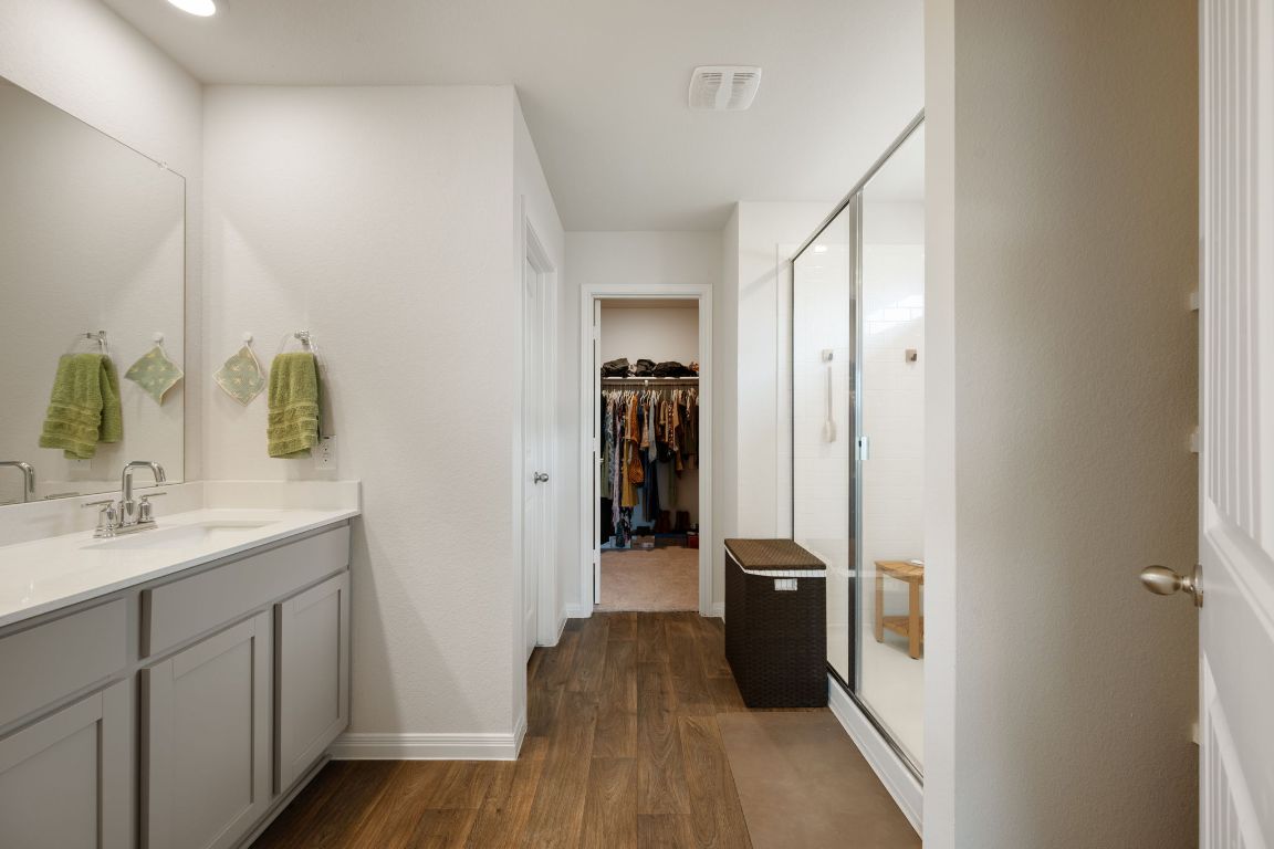 13908 Mamie Eisenhower Road Manor, TX 78653 - Photo 12 of 23 a bathroom with a sink and a mirror