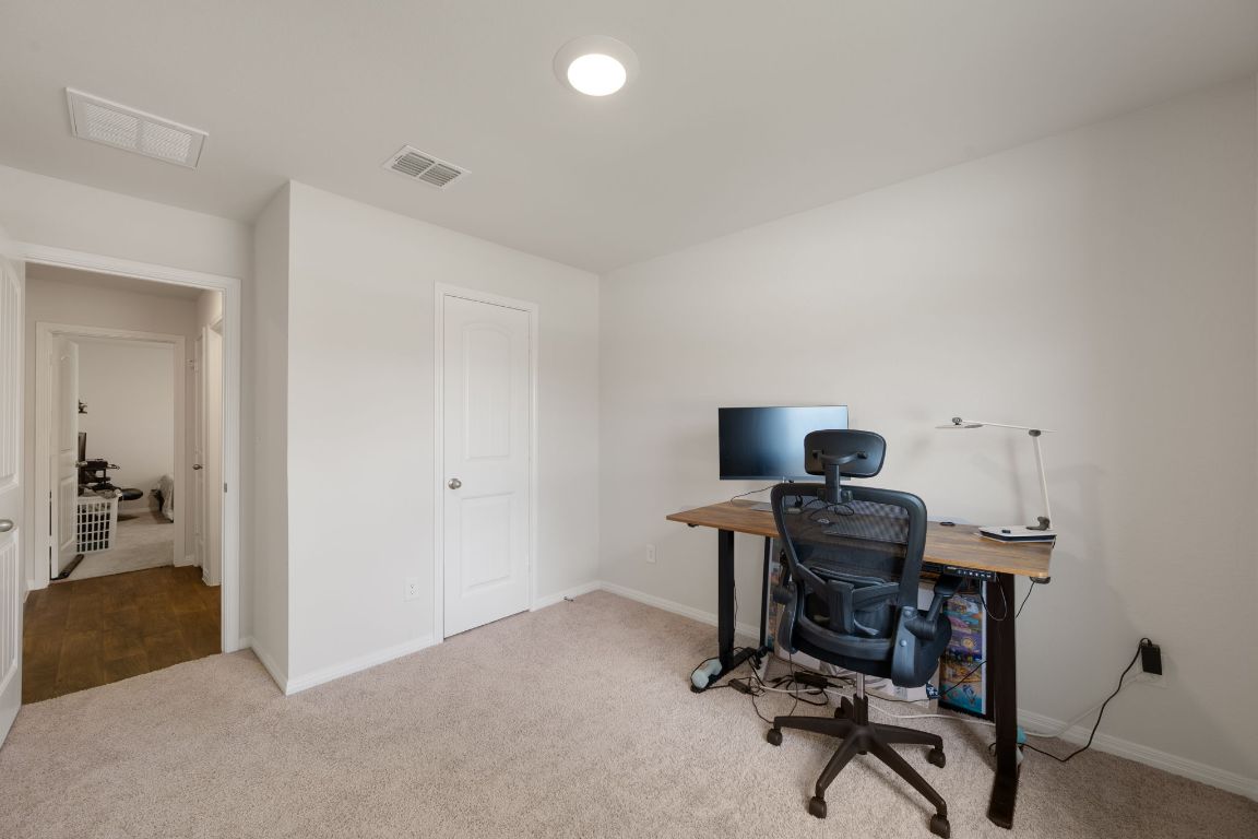 13908 Mamie Eisenhower Road Manor, TX 78653 - Photo 16 of 23 a view of a workspace with furniture