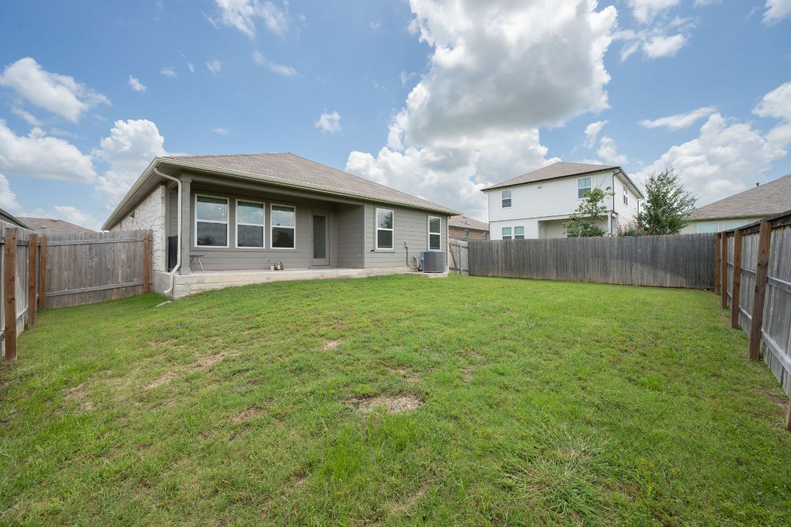 13908 Mamie Eisenhower Road Manor, TX 78653 - Photo 20 of 23 a view of a house with a yard and sitting area
