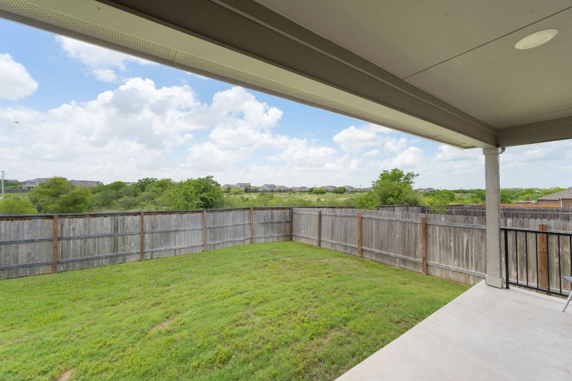 13908 Mamie Eisenhower Road Manor, TX 78653 - Photo 22 of 23 a view of a backyard with a garden