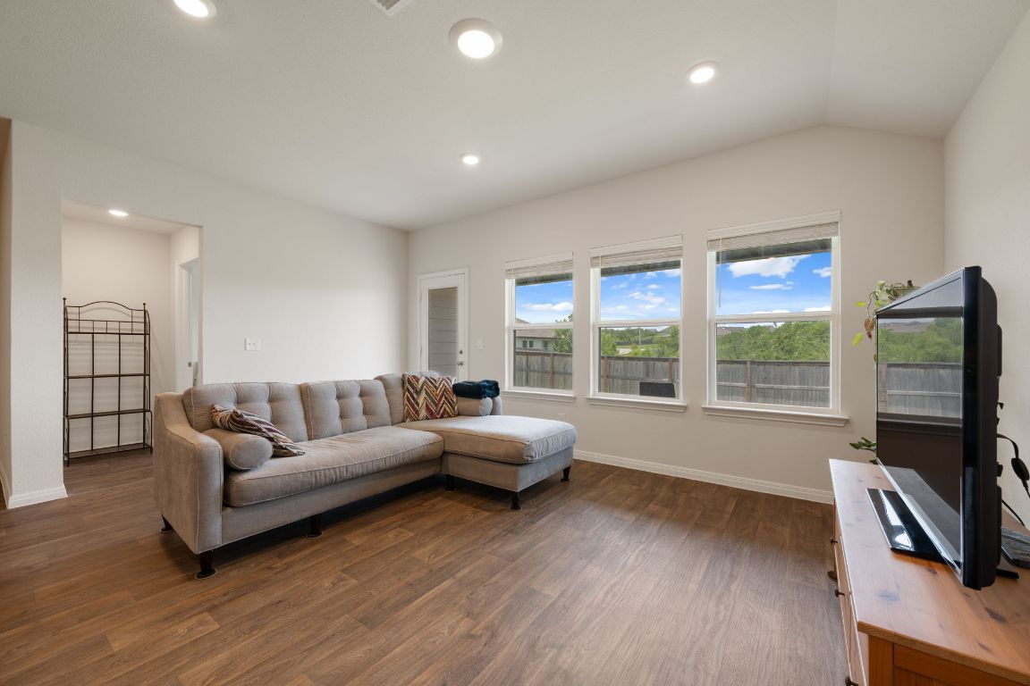 13908 Mamie Eisenhower Road Manor, TX 78653 - Photo 3 of 23 a living room with furniture window and a flat screen tv