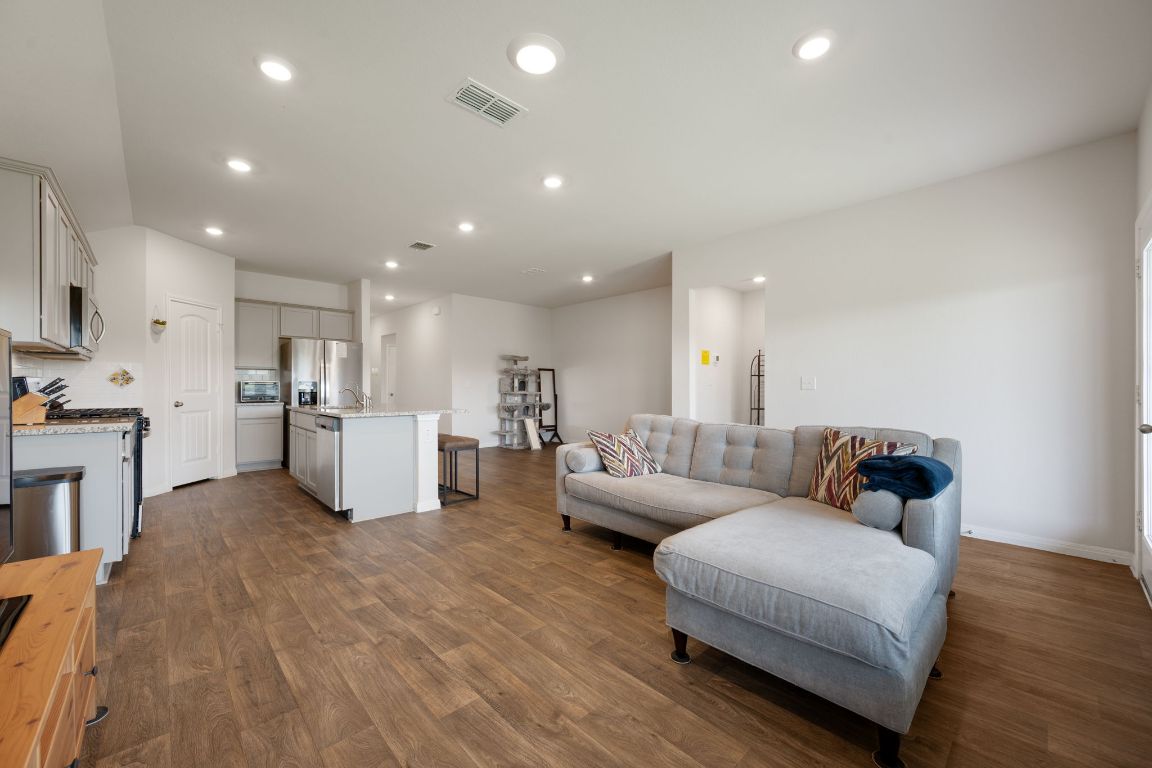 13908 Mamie Eisenhower Road Manor, TX 78653 - Photo 4 of 23 a living room with furniture and kitchen view