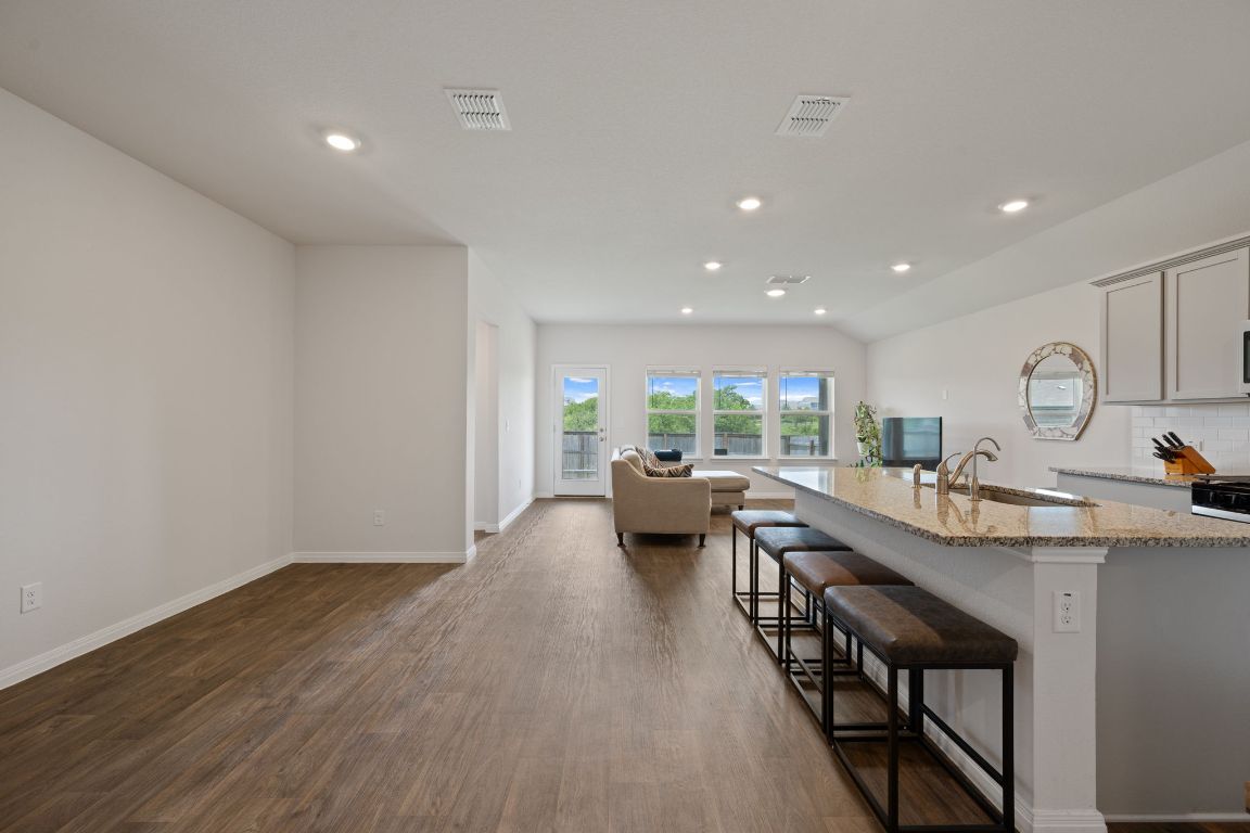13908 Mamie Eisenhower Road Manor, TX 78653 - Photo 5 of 23 a kitchen with sink and view of living room