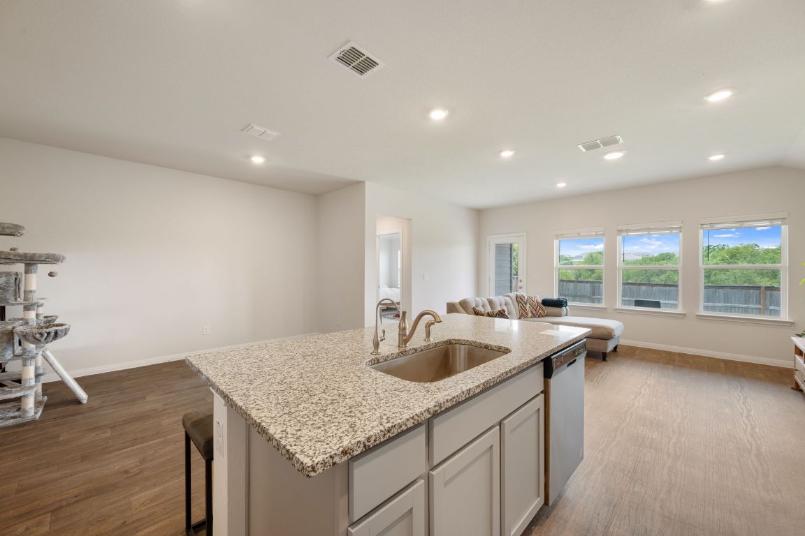 13908 Mamie Eisenhower Road Manor, TX 78653 - Photo 6 of 23 a kitchen with sink and refrigerator