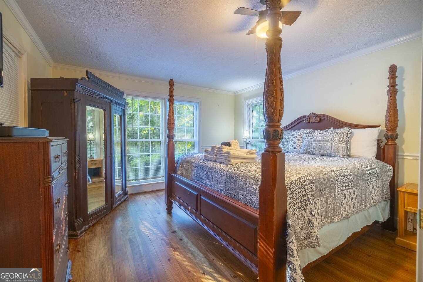 144 Fussen Strasse Helen, GA 30545 - Photo 16 of 38 a bedroom with a bed and wooden floor
