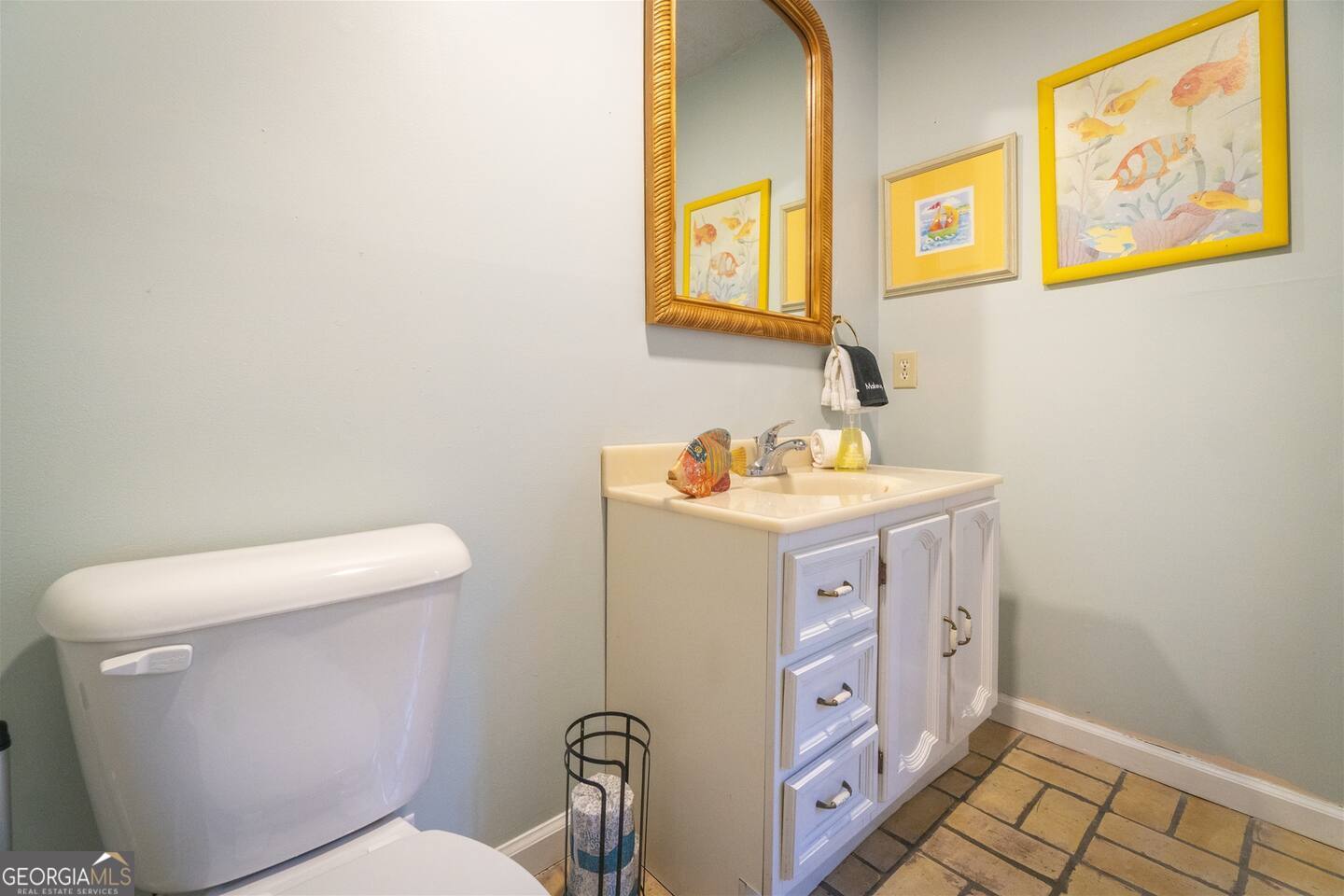 144 Fussen Strasse Helen, GA 30545 - Photo 17 of 38 a bathroom with a toilet sink and mirror