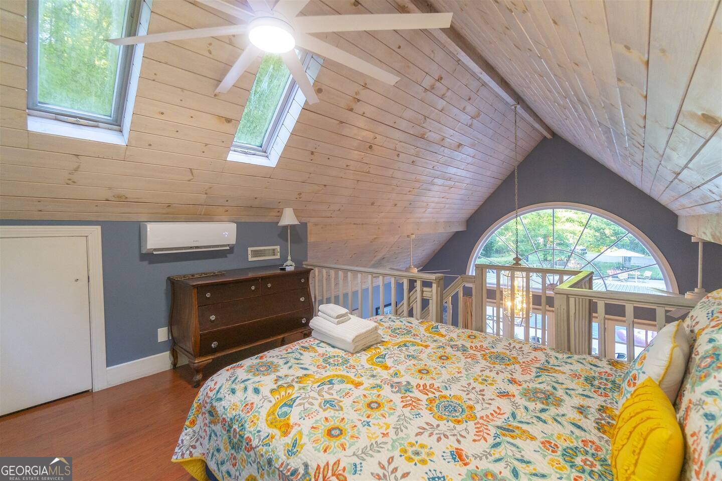 144 Fussen Strasse Helen, GA 30545 - Photo 27 of 38 a bedroom with a bed and a large window