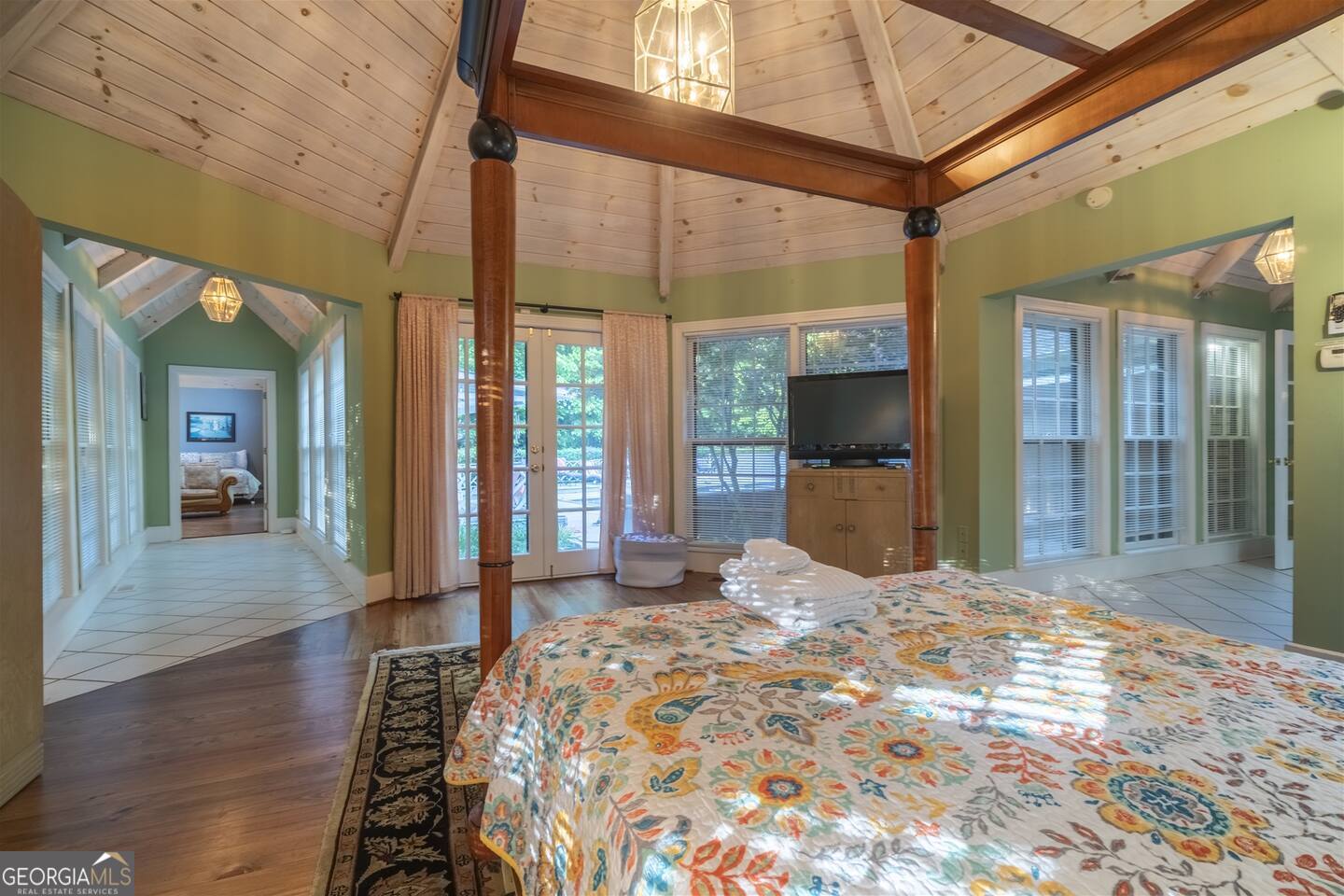 144 Fussen Strasse Helen, GA 30545 - Photo 9 of 38 a large bedroom with wooden floor and balcony