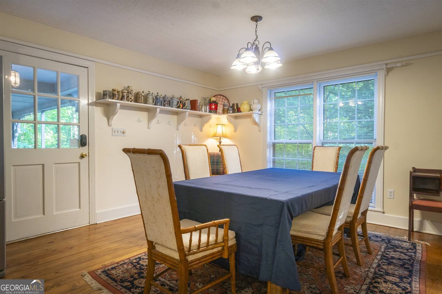 144 Fussen Strasse Helen, GA 30545 - Photo 10 of 38 a dining room with furniture a chandelier and wooden floor