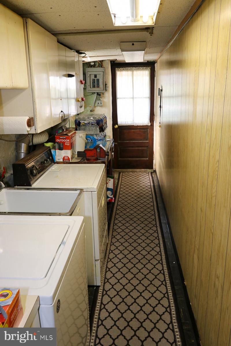 868 Medway Road Philadelphia, PA 19115 - Photo 48 of 56 Laundry area with door to rear driveway and yard