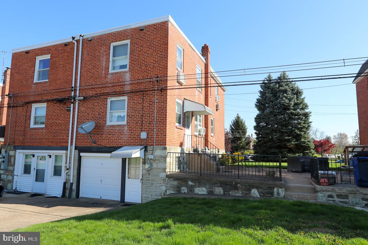 868 Medway Road Philadelphia, PA 19115 - Photo 52 of 56 Exterior rear of home with yard and garage