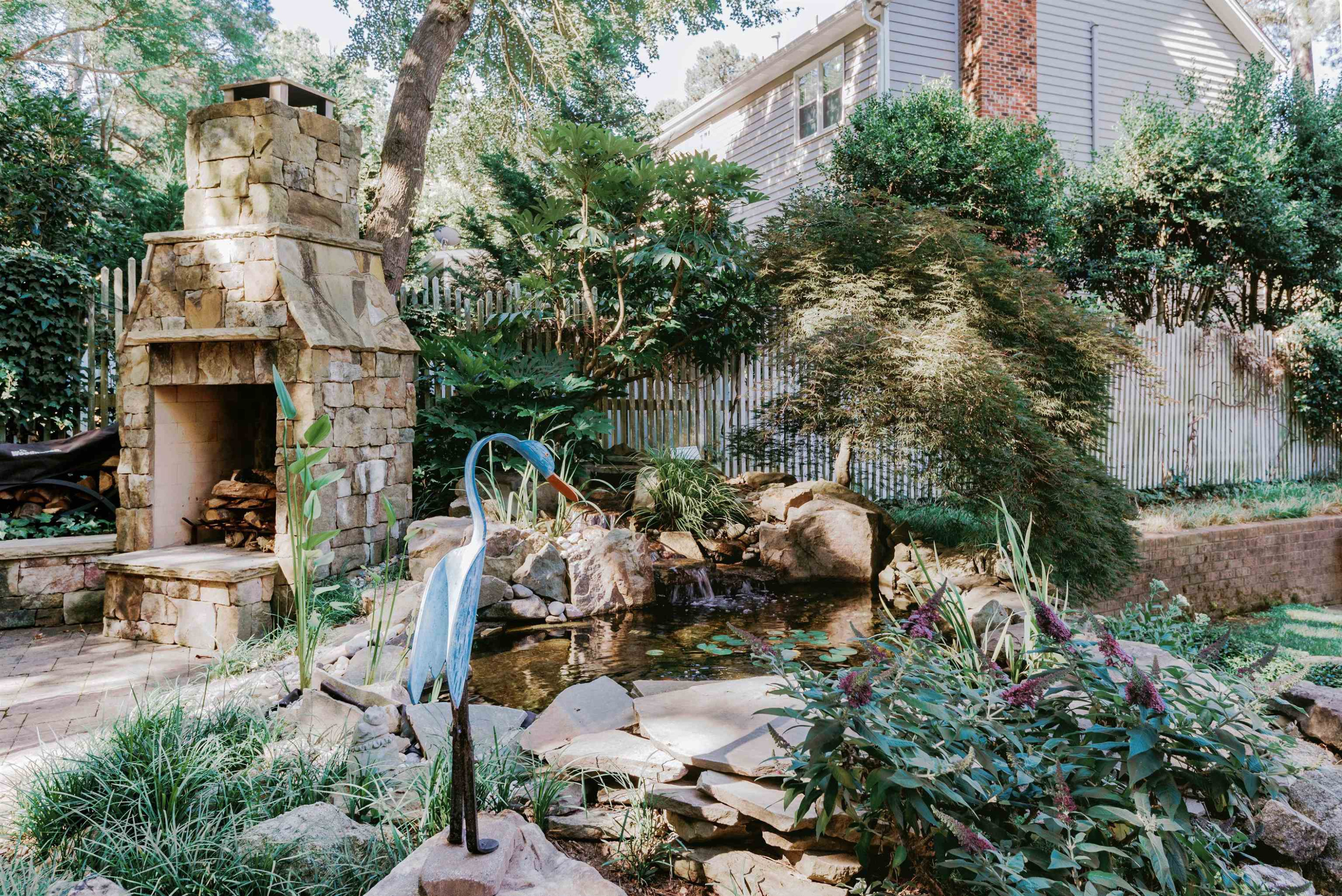 6928 Slade Hill Road Raleigh, NC 27615 - Photo 15 of 46 Outdoor Fireplace-Koi Pond
