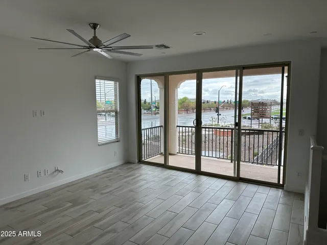 a view of a kitchen with a sink and wooden floor