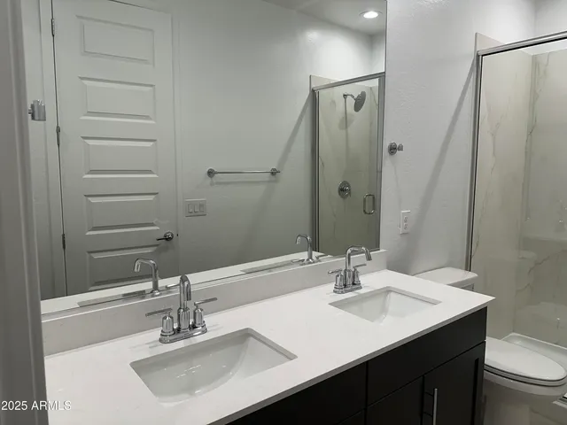 a bathroom with a shower and a sink