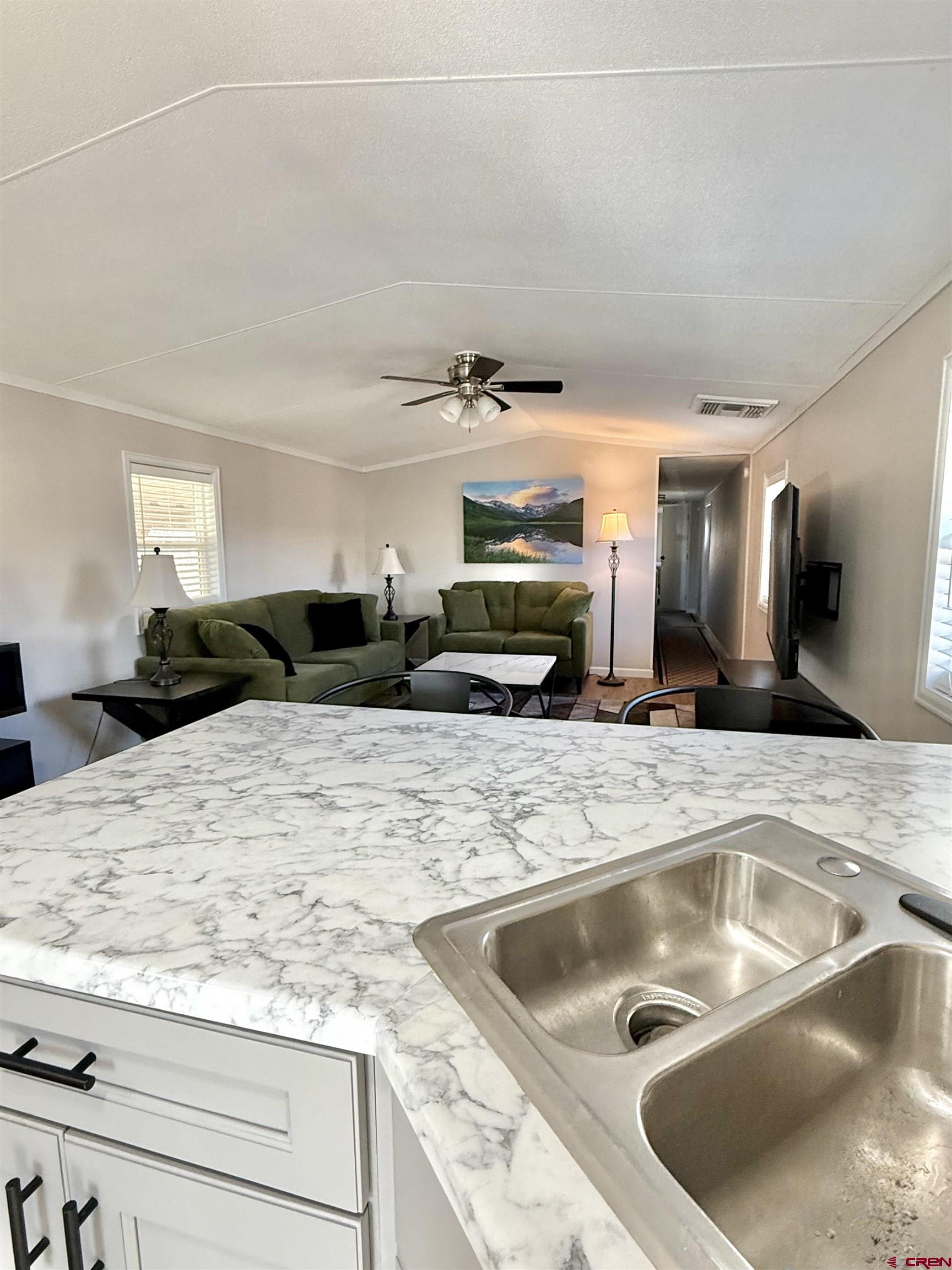676 Highway 50, Unit SPACE 44 Delta, CO 81416 - Photo 12 of 29 a kitchen with a sink and a refrigerator