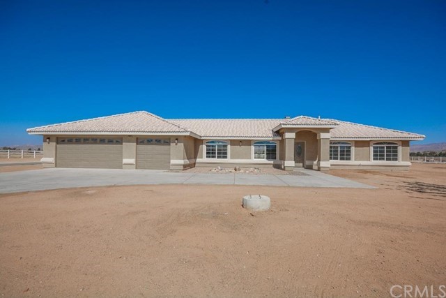 23420 Cherokee Road Apple Valley, CA 92307 - Photo 1 of 1 a front view of a house with yard